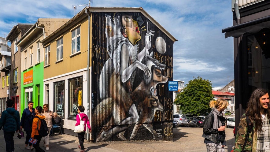 A mural on a corrugated iron house gives alternate effects as opposed to a barren wall