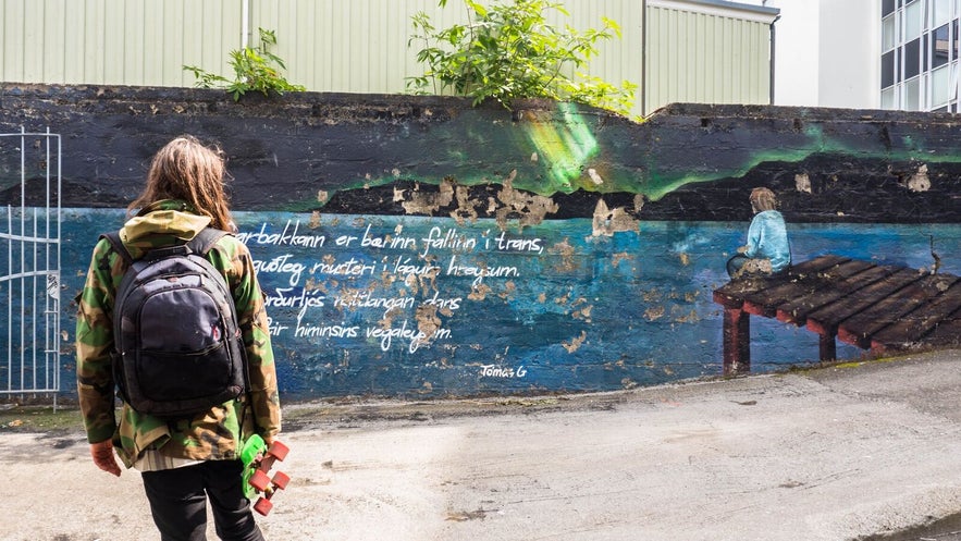 A mural inspired by Tómas Guðmundsson's poet about Hafnarbakki, located at Hafnarbakki itself