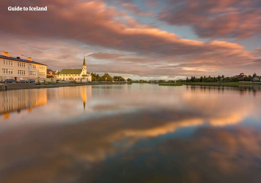 A dusk shot overlooking  Tjörnin. One can see Fríkirkjan í Reykjavík church to the left.