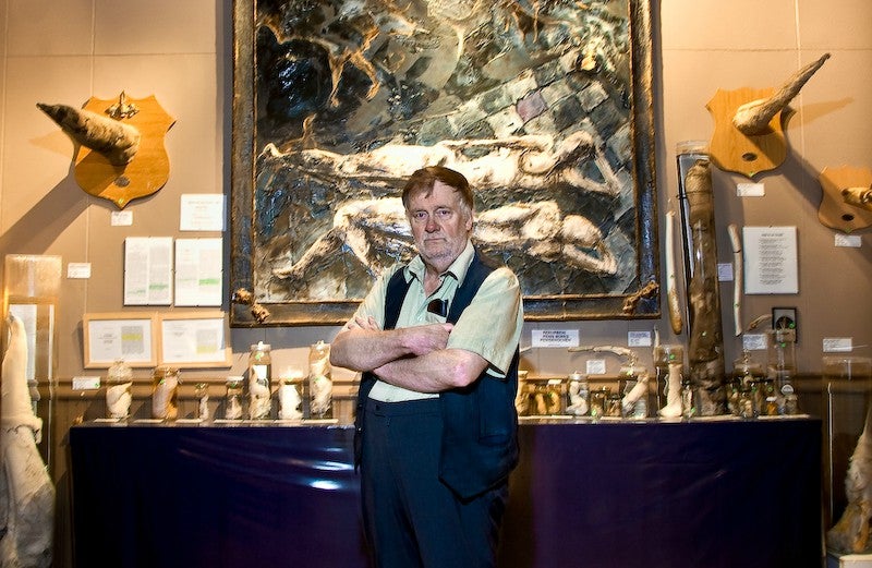 The museum's founder, Sigurður Hjartarson, proudly displaying his many, many penises.