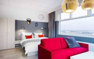 A comfortable double bed and a couch await guests of Icelandic Apartments.