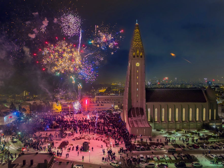 Bird's-eye-view of New Year's fireworks celebrations in the public square in front of Hallgrimskirkja