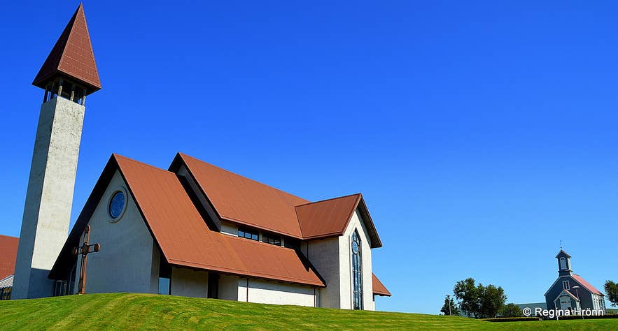 The modern Reykholt Church with its bell tower, with the older timber church beside it.