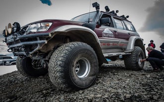 A close up of the front side of a super jeep.