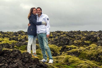 A couple pose on a lava field on the Reykjanes peninsula.