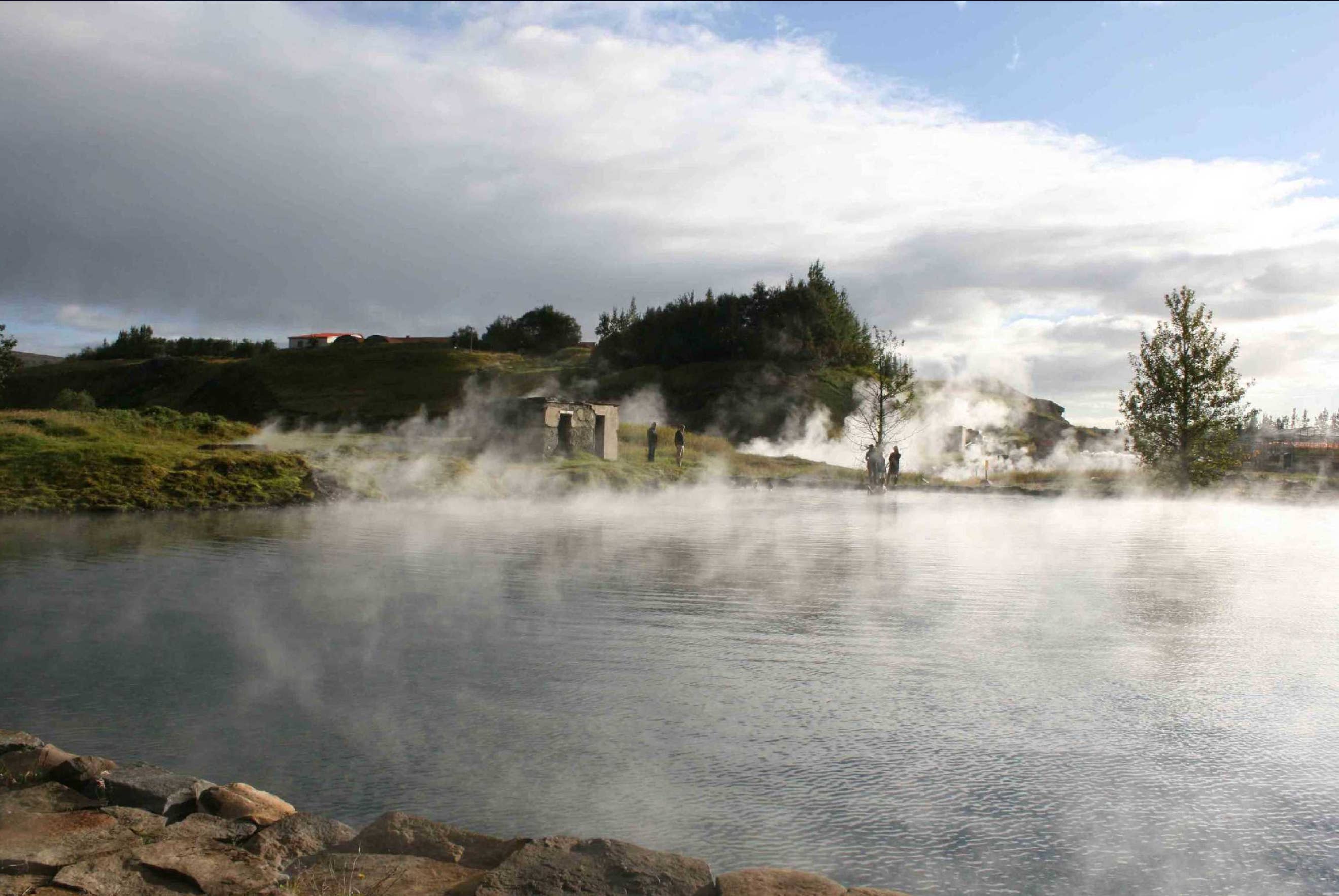 Steam rises from warm geothermal waters in Iceland.