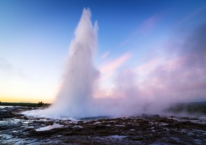 The Golden Circle's Strokkur geyser puts on a dramatic eruption with superheated water.