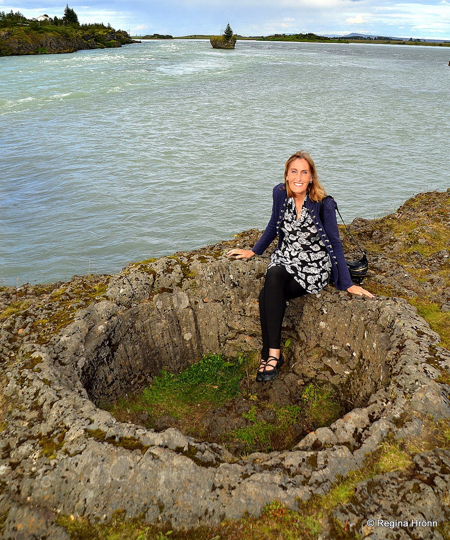 Regína sitting in a lava pot by Ölfusá South-Iceland