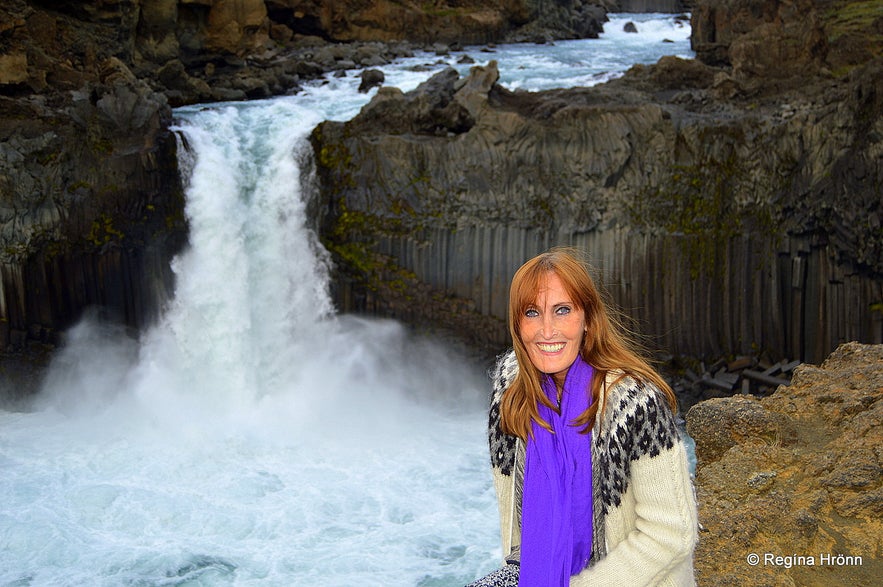 Regína by the extraordinary Aldeyjarfoss Waterfall in North-Iceland in beautiful Basalt Column Settings