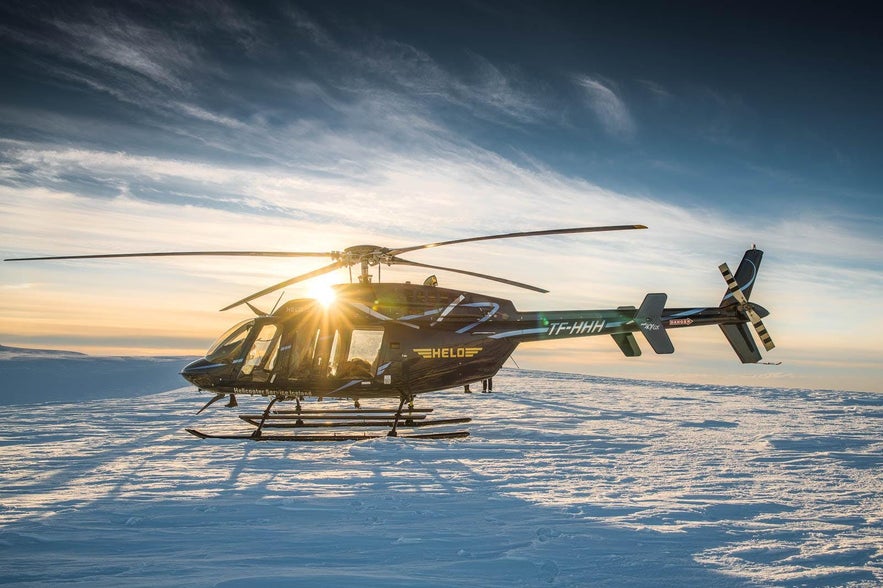 A helicopter that has landed on Langjökull, the second largest glacier in Iceland.