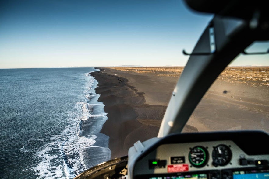 The South Coast, as seen from the cockpit of a helicopter.