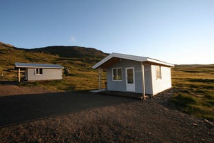 An outdoor shot of one of Urdartindur's Cabins.