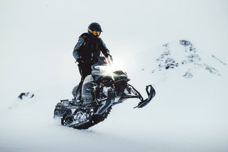 A man on a snowmobile during the Langjokull glacier tour.