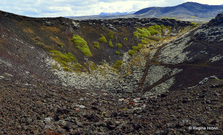 Burfellsgja Lava Gorge with volcanic craters in Iceland
