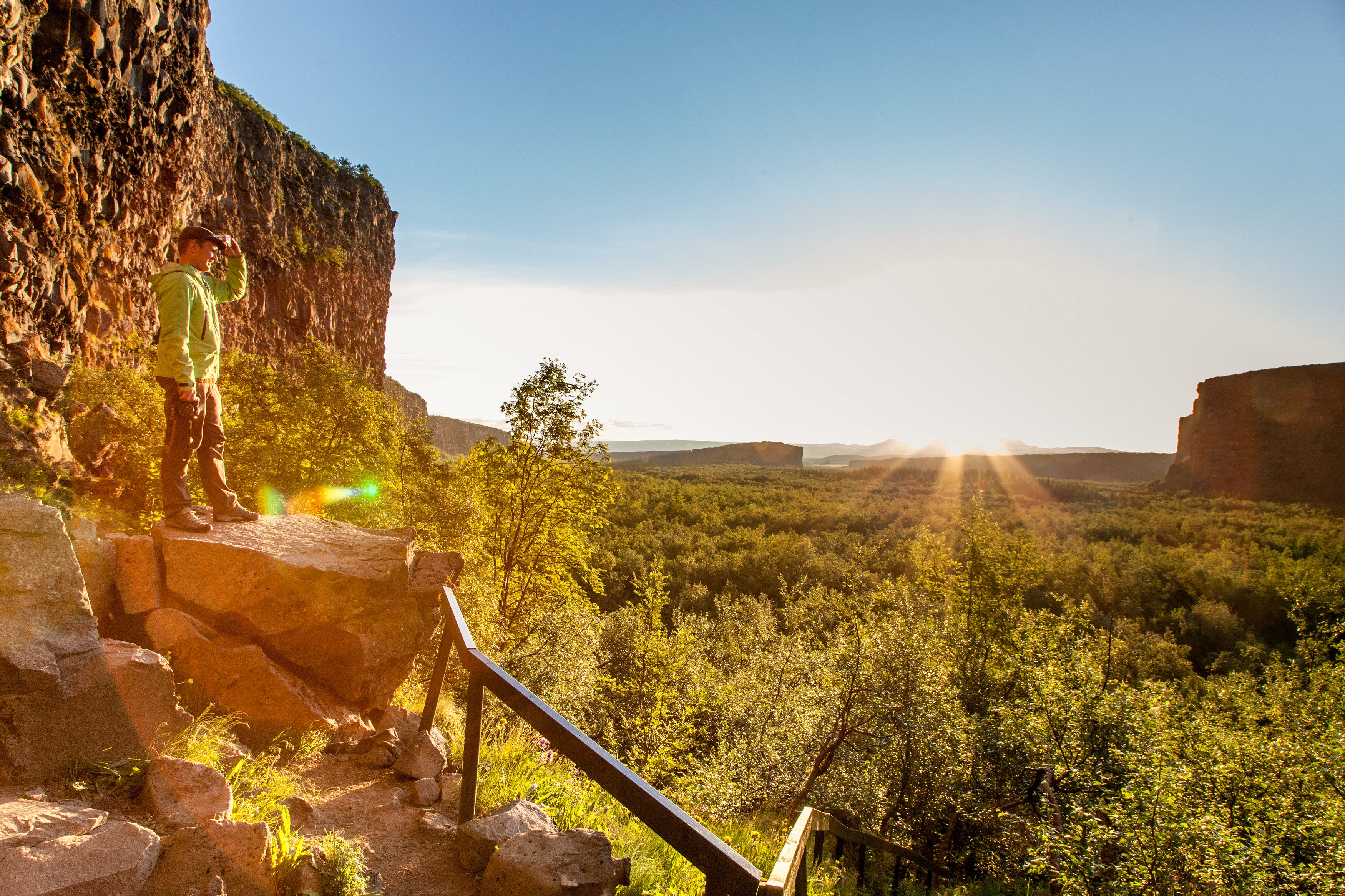 A traveler exploring the woodlands of Asbyrgi canyon.