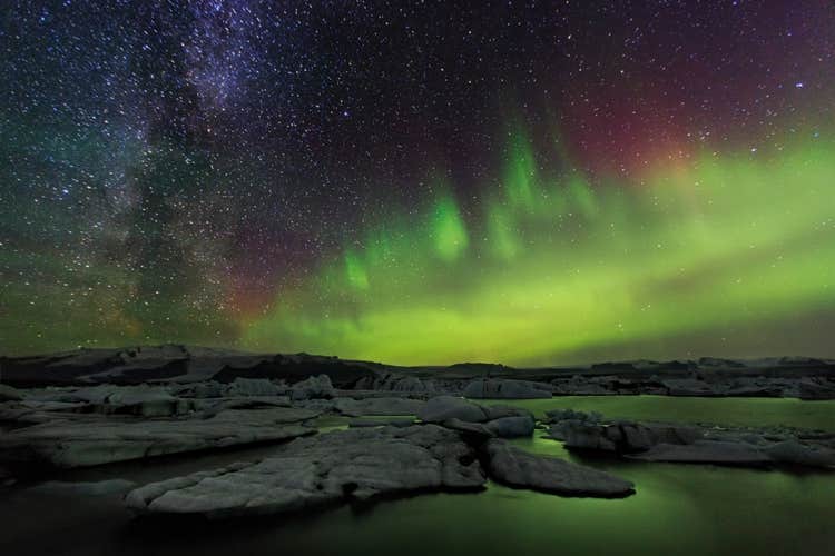 The aurora borealis lighting up the winter sky above Jökulsárlón glacier lagoon.