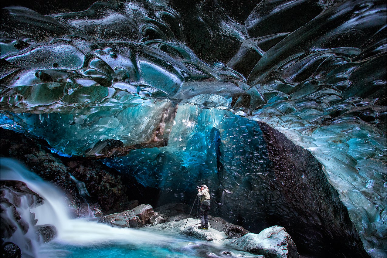 Find the perfect photo opportunity in an ice cave.