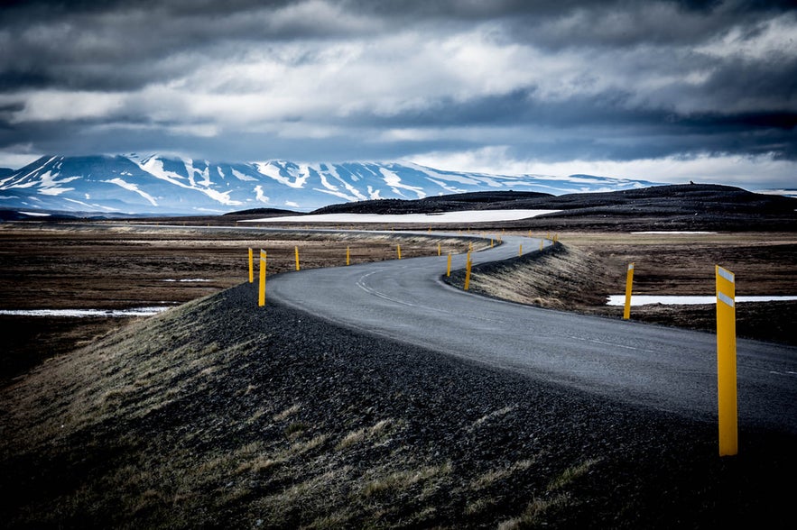 A typical Icelandic road winds through the countryside. A typical Icelandic road winds through the countryside.