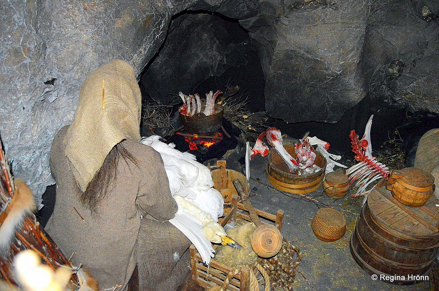 Halla preparing dinner in Eyvindarhellir cave at the exhibition in Blönduós village