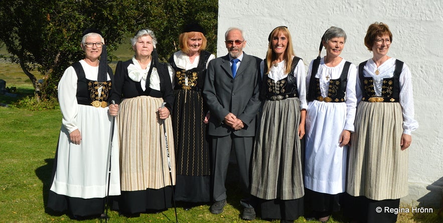 Regína dressed in a national costume by Þverárkirkja church North-Iceland