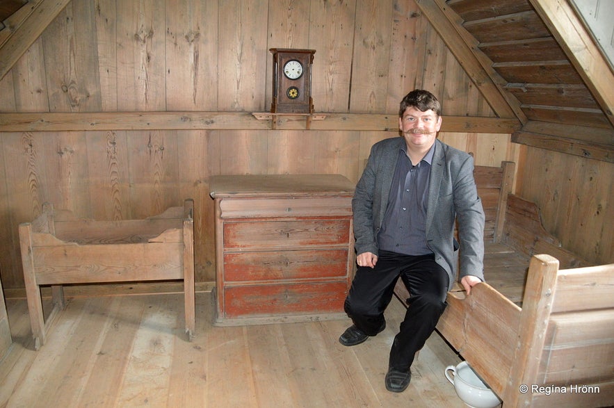 Regína's husband inside Þverá Turf House in North-Iceland