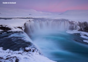 The stunning Godafoss waterfall blanketed with snow.