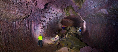 Exploring the massive and colorful Vidgelmir lava tube is an incredible experience.