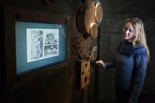 A woman admiring an old poling system that is at display at the Wilderness Center exhibition in East Iceland.