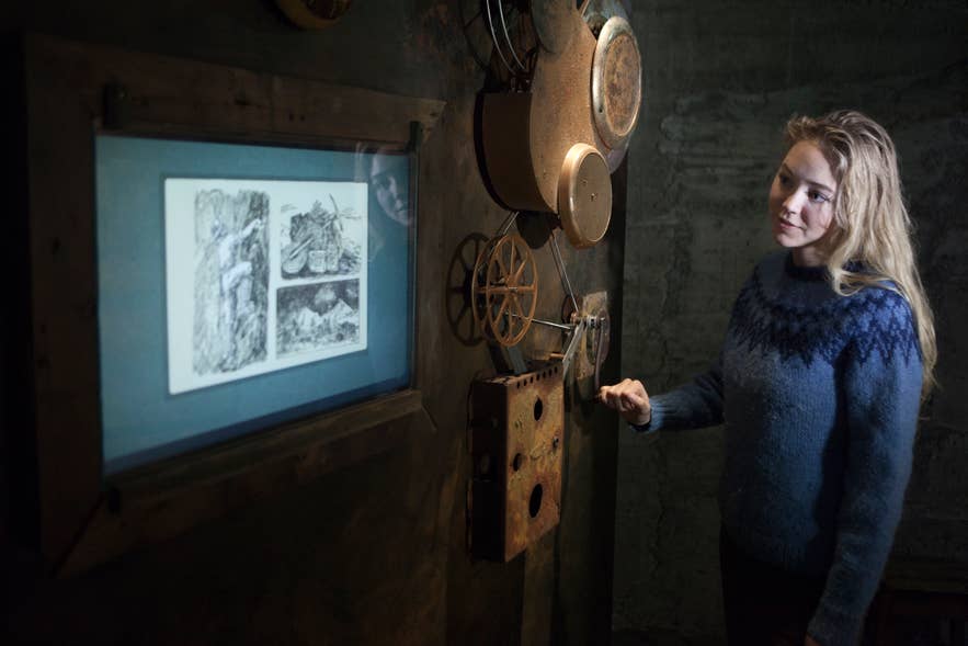 Visitor exploring an interactive exhibit at the Wilderness Center in East Iceland