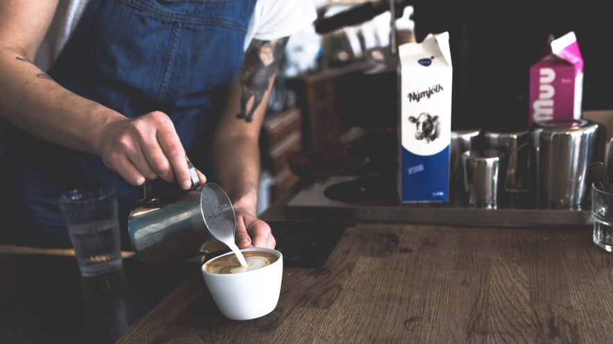 Barista pouring artisanal coffee.