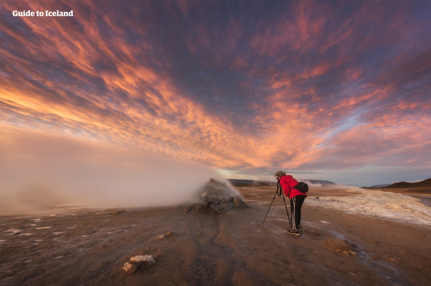 A photographer captures the scene at Námaskarð Pass.