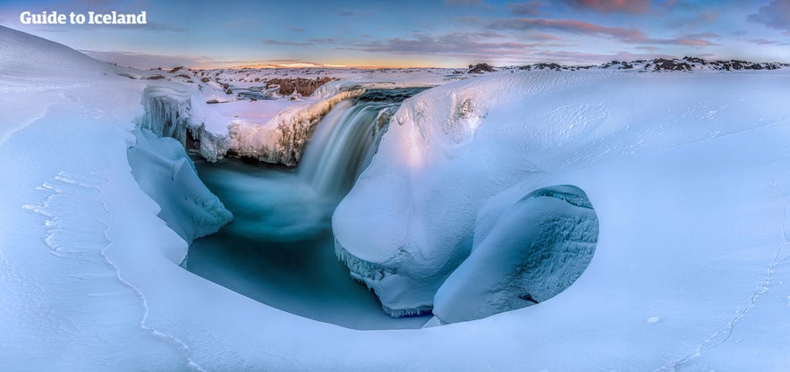 Hrafnabjargafoss is horseshoe shaped, although this is hard to see in winter. Hrafnabjargafoss is horseshoe shaped, although this is hard to see in winter.