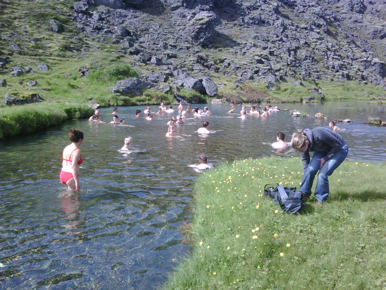 A group of people bathing in hot springs in Landmannalaugar.