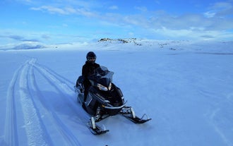North Iceland's snowy mountains and landscapes are perfect for thrilling snowmobiling tours.