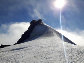 The peak of Snæfellsjökull glacier in the clouds.