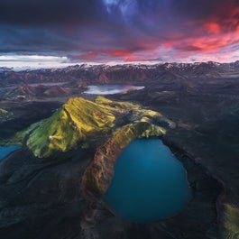 A highland crater lake under the midnight sun.