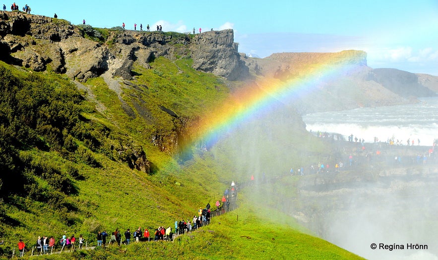 People on the trail leading to Gullfoss waterfall People on the trail leading to Gullfoss waterfall