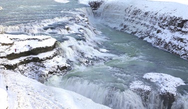 The Gullfoss waterfall, one of three Golden Circle attractions, is a stunning snow-covered natural wonder during winter.