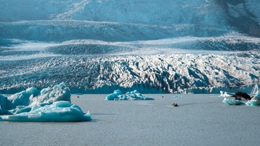 Icebergs floating in the Fjallsarlon glacier lagoon in Iceland.