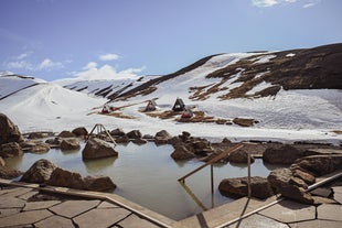 Snow surrounds the Highland Baths in Iceland's interior.