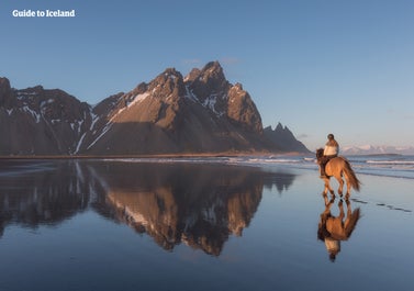 Vestrahorn mountain is framed by a breathtaking bay in Southeast Iceland.