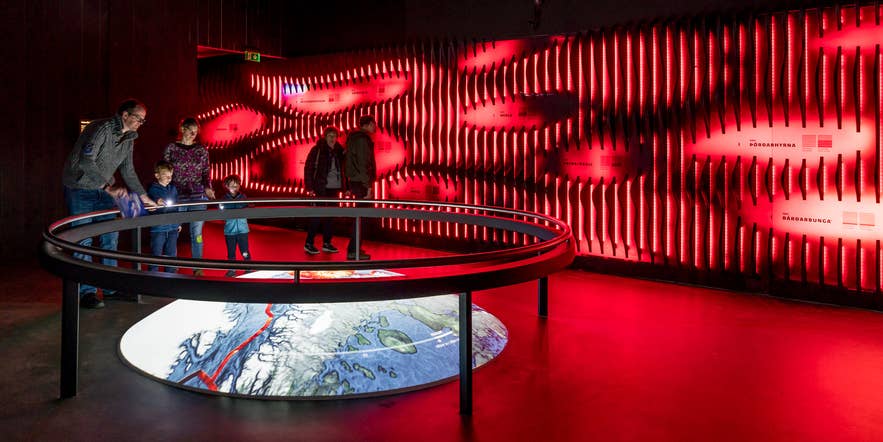 Families exploring volcanic displays at the Lava Centre in Iceland
