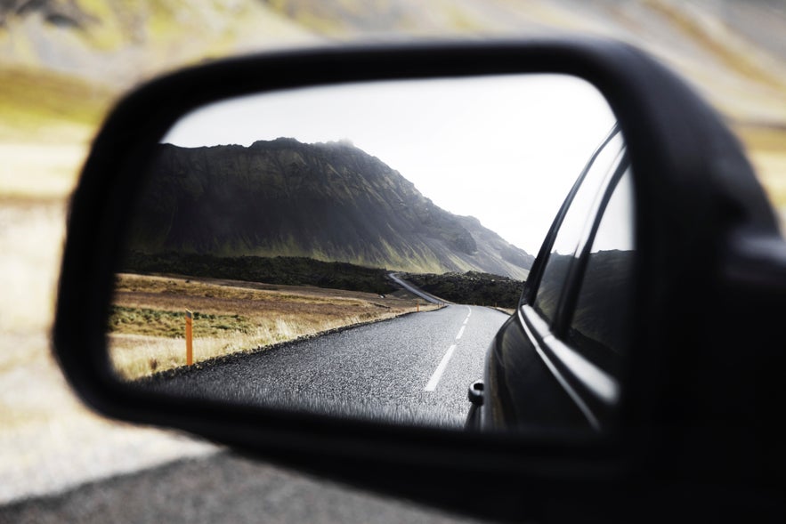 An image of the beautiful landscape of Iceland in a side view mirror An image of the beautiful landscape of Iceland in a side view mirror