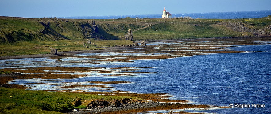 Kollafjarðarneskirkja church in the distance and the 2 trolls