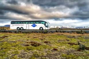 The bus with passengers inside is on its way to its destination.