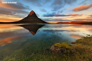 Kirkjufell mountain at dusk during summer in Iceland.