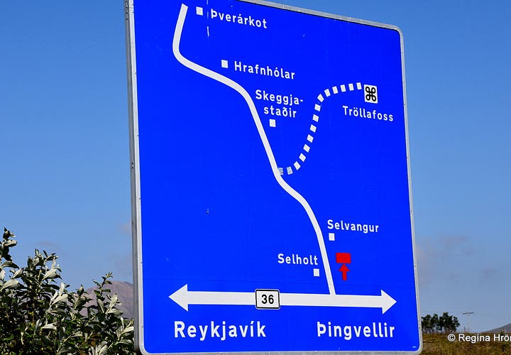 Road sign leading to Tröllafoss waterfall