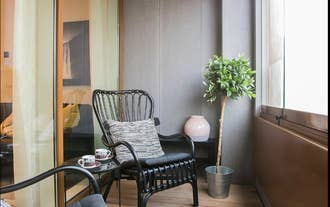 Two chairs on the balcony at Salka Suites.