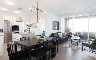 The open-plan kitchen, living room, and dining area at Salka Suites.