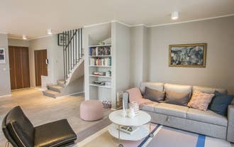 Penthouse Downtown's living room is spacious.
